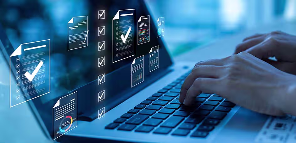 Hands on a laptop with holographic overlay of documents with checkboxes